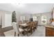 Large dining room with a big wooden table and holiday decorations at 4535 Se 32Nd Pl, Ocala, FL 34480