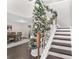 Entryway featuring staircase and Christmas tree, opens to dining room with hardwood floors at 4535 Se 32Nd Pl, Ocala, FL 34480