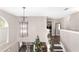 A view of the foyer decorated with garland, dining area, and living room at 4535 Se 32Nd Pl, Ocala, FL 34480