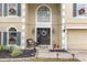 Charming home entrance showcasing detailed trim and a festive wreath at the front door at 4535 Se 32Nd Pl, Ocala, FL 34480