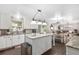 Bright open concept kitchen with island and adjacent Gathering room and dining area at 4535 Se 32Nd Pl, Ocala, FL 34480