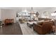 Spacious living area featuring open layout, leather sectional, modern furnishings, and natural light at 4535 Se 32Nd Pl, Ocala, FL 34480
