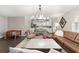Open-concept living area featuring kitchen view, seating, and hardwood floors at 4535 Se 32Nd Pl, Ocala, FL 34480
