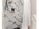 Detailed view of the shower with marble tile, gold fixtures, and niche for toiletries at 4535 Se 32Nd Pl, Ocala, FL 34480