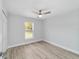 Bright bedroom with a ceiling fan, light gray walls, and wood-look flooring at 1052 Sw 158Th Ct, Ocala, FL 34481