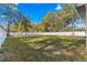 Spacious backyard surrounded by a white fence at 14152 Se 43Rd Ter, Summerfield, FL 34491