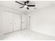 Spacious bedroom with double doors and marble flooring at 14152 Se 43Rd Ter, Summerfield, FL 34491