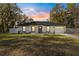 Newly constructed home showcasing a white exterior, gray door, and attached garage at 14152 Se 43Rd Ter, Summerfield, FL 34491