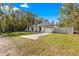 Single story house with white exterior and fenced yard at 14152 Se 43Rd Ter, Summerfield, FL 34491