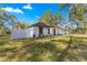 Single story home with white exterior and gray accents at 14152 Se 43Rd Ter, Summerfield, FL 34491