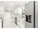 Modern kitchen with white cabinets and quartz countertops at 14152 Se 43Rd Ter, Summerfield, FL 34491