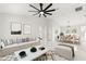 Living room with contemporary furniture and large windows at 14152 Se 43Rd Ter, Summerfield, FL 34491