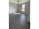 Bright bedroom with natural light and luxury vinyl plank flooring at 17781 Sw 72Nd Street Rd, Dunnellon, FL 34432