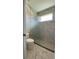 Modern bathroom featuring a glass-enclosed shower with marble-look tile at 17781 Sw 72Nd Street Rd, Dunnellon, FL 34432