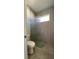 A bathroom with a glass-enclosed shower and a toilet in view at 17841 Sw 72Nd Street Rd, Dunnellon, FL 34432