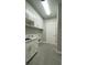 Laundry room with updated washer/dryer, sink, and counter space at 17841 Sw 72Nd Street Rd, Dunnellon, FL 34432