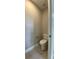 Small toilet room with a tiled floor features a standard toilet at 17841 Sw 72Nd Street Rd, Dunnellon, FL 34432