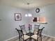 Cozy dining room features a glass table, seating for four, and a decorative light fixture at 4961 Sw 196Th Ave, Dunnellon, FL 34431