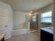 Bathroom with separate tub and glass enclosed shower at 9115 Sw 49Th Ct, Ocala, FL 34476
