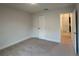 Bedroom has neutral carpet, double door closet, and an open doorway to an adjacent room at 9115 Sw 49Th Ct, Ocala, FL 34476