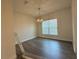Dining room with hardwood floors, modern chandelier, and natural light at 9115 Sw 49Th Ct, Ocala, FL 34476