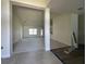 Open concept living room and kitchen area with tile and carpet flooring at 9115 Sw 49Th Ct, Ocala, FL 34476