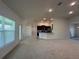 Open-concept living room and kitchen area with lots of natural light from the surrounding windows at 9115 Sw 49Th Ct, Ocala, FL 34476