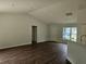 Spacious living room boasting vaulted ceilings, LVP floors and tons of natural light at 15067 Se 61St Ct, Summerfield, FL 34491