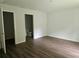 Bright and spacious main bedroom with sleek flooring and an en-suite bathroom at 15067 Se 61St Ct, Summerfield, FL 34491
