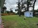 Large backyard with a storage shed and plenty of green space at 762 Temple Ave, Orange City, FL 32763