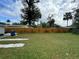 Large backyard with fenced perimeter, grassy lawn, and wooden privacy fence at 762 Temple Ave, Orange City, FL 32763