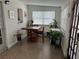 Bright dining area with a table and chairs, near a sunlit window at 762 Temple Ave, Orange City, FL 32763