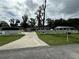 Long driveway leading to the house with a white farm fence at 762 Temple Ave, Orange City, FL 32763