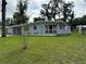 House exterior showcasing a mid-century modern design at 762 Temple Ave, Orange City, FL 32763