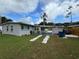 Ranch style home with carport, and well-maintained lawn at 762 Temple Ave, Orange City, FL 32763