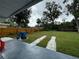 Backyard patio with a grassy area and a wooden fence at 762 Temple Ave, Orange City, FL 32763