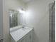 Modern bathroom with a vanity, a mirror, and a shower at 13850 Se 42Nd Ave, Summerfield, FL 34491