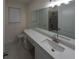 Bathroom with white vanity and granite countertop at 13850 Se 42Nd Ave, Summerfield, FL 34491