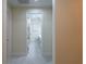 View down hallway to modern bathroom at 13850 Se 42Nd Ave, Summerfield, FL 34491