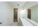 Elegant bathroom with double vanity, quartz countertop and shower at 13850 Se 42Nd Ave, Summerfield, FL 34491