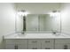 Double vanity bathroom with quartz countertop and modern faucets at 13850 Se 42Nd Ave, Summerfield, FL 34491