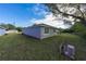 House exterior with a view of the backyard and landscaping at 13850 Se 42Nd Ave, Summerfield, FL 34491