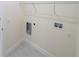 Laundry room with shelving and space for washer and dryer hookups at 13850 Se 42Nd Ave, Summerfield, FL 34491