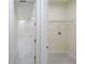 Laundry room with wire shelving and a tiled floor at 13850 Se 42Nd Ave, Summerfield, FL 34491