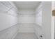 Large walk-in closet featuring wire shelving for storage at 13850 Se 42Nd Ave, Summerfield, FL 34491