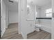 Modern bathroom with white vanity, bathtub, and blue tile at 45 Water Trak, Ocala, FL 34472