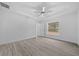 Light-filled bedroom featuring wood-look floors and a window with natural light at 45 Water Trak, Ocala, FL 34472