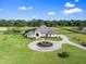 Aerial view of house, expansive lot, and circular driveway at 6892 Nw 54Th Loop, Ocala, FL 34482