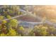 Aerial view of a gray house with a gray roof surrounded by trees at 11837 Se 165 Ave, Ocklawaha, FL 32179