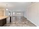 Bright living room featuring hardwood flooring, neutral paint, large windows, and an open space layout at 11837 Se 165 Ave, Ocklawaha, FL 32179